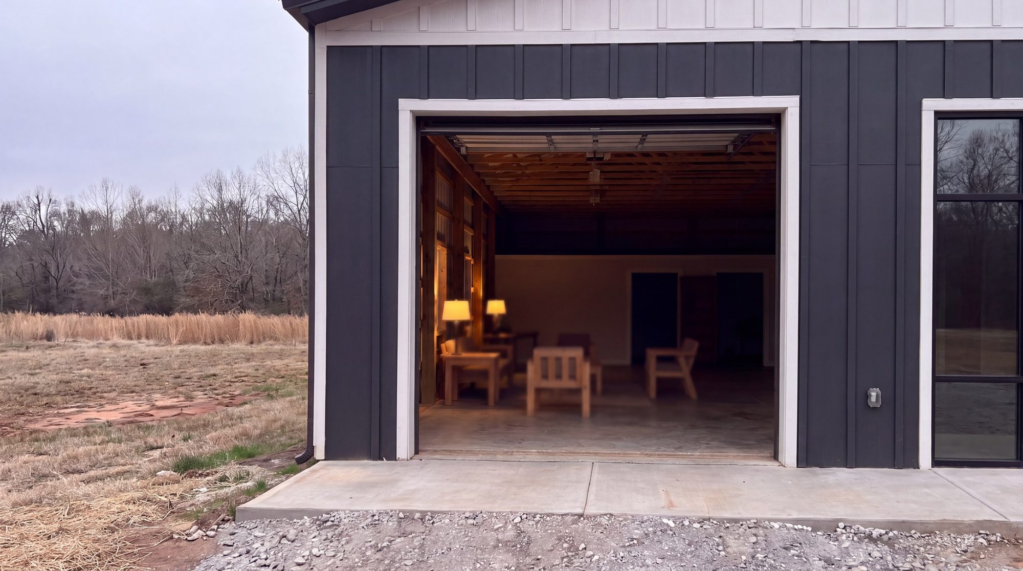 The big door open at Shiloh Collective, lamps lit inside